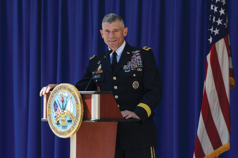 Keynote speaker Robert Caslen addresses an audience while in full military attire