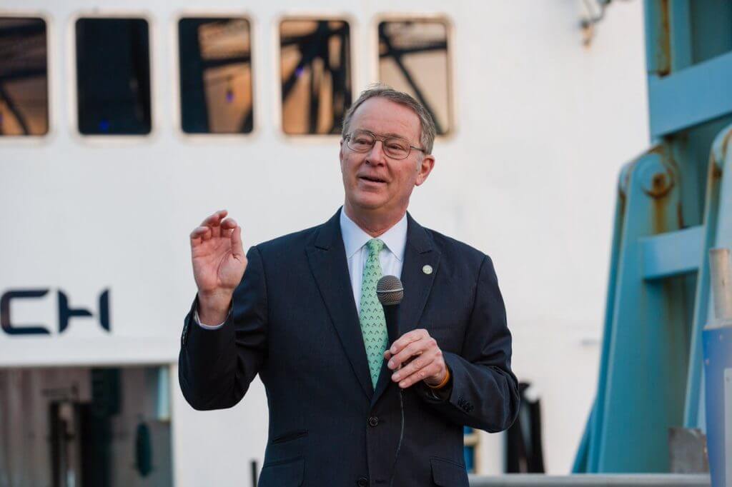 Keynote speaker Donnie Horner is pictured mid-speech, while holding a microphone